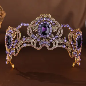 Vintage gold crystal tiara detail shot, showing intricate rhinestone and purple stone patterns.