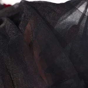 Close-up detail of exquisite black mesh tulle fabric for women hair accessory and photography props.