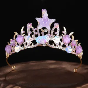 Close-up detail of the handmade ocean starfish and seashell crown, sparkling tiara design