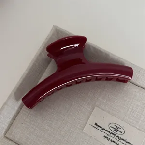 Elegant dark red hair claw clip, premium minimalist design for daily hair styling and updos.