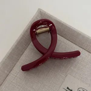 Red hair claw clip for women, elegant geometric shark clip hair accessory for styling.