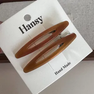 Elegant brown oval hair clips set, stylish hairpin for women and daily hair styling use.