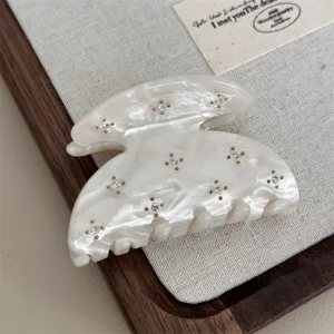 White acetate hair claw clip with delicate rhinestone inlay, minimalist vintage design.