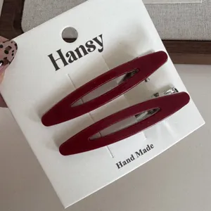 Red hollow oval hair clips set, elegant metal duckbill clip for women daily hair styling.