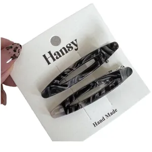 Minimalist marble pattern oval hair clip set, chic acrylic duckbill hairpins for women styling.