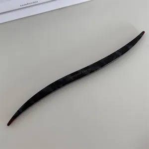 Elegant acetate hair stick detail view, tortoise shell pattern minimalist hairpin for styling chic buns.