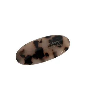 Elegante molletta per capelli ovale in acetato con motivo tartaruga in stile francese.