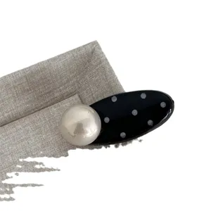 Cute black and white polka dot pearl duckbill hair clip, sweet oval side clip for women.