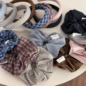 Detailed close-up of retro plaid and stripe fabric headbands and scrunchies collection.