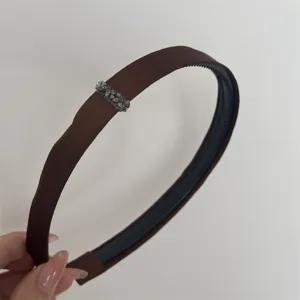 Brown satin headband with sparkling rhinestones, elegant hair accessory for daily wear and parties.