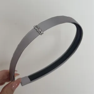 Grey satin rhinestone headband detail shot, elegant crystal hair hoop accessory for women.
