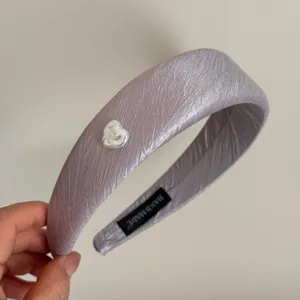 Silver purple satin headband with a white heart charm, elegant hair accessory for women.