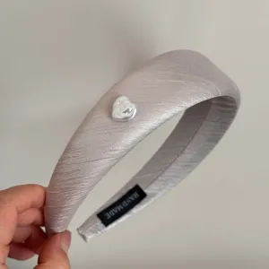 Elegant silver satin hair hoop with a cute heart pearl embellishment, stylish and soft headband.