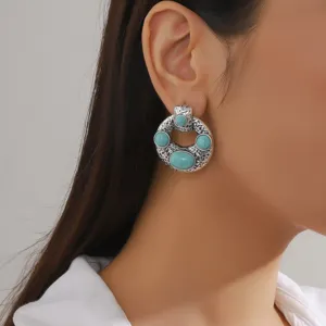 Detailed view of bohemian vintage silver carved turquoise hoop earrings for women charm.