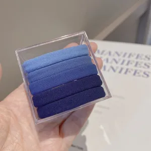 5-piece gradient blue seamless hair ties set with clear box detail view for daily styling.
