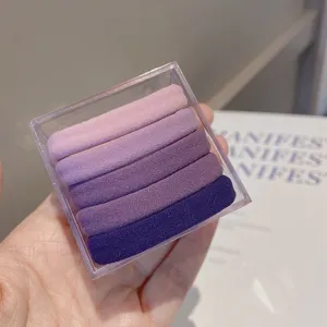 Gradient purple seamless hair ties set of 5 pieces in a clear storage box for daily styling.