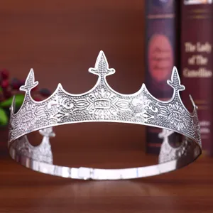 Close-up of vintage silver crown detail, intricate embossed metal pattern for men performance.