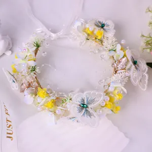 Handmade fairy butterfly flower crown headband with pearls and lace for wedding party.