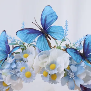 Detailed close-up view of the baroque blue butterfly floral headband and daisy hair accessories.