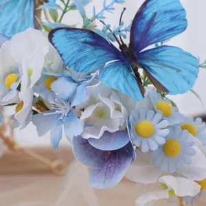 Close-up detail of blue artificial butterfly floral crown headband, elegant hair accessory.