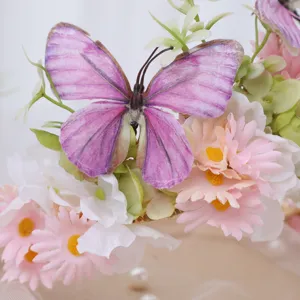 Close-up detail of exquisite artificial daisy flowers and purple butterfly hair accessory.