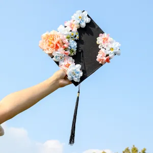 Floral graduation cap with tassel, black square academic cap for graduation party photo decor.