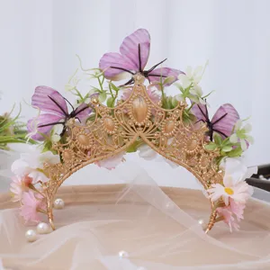 Baroque gold tiara headband featuring purple butterflies and pink silk flowers for photography.