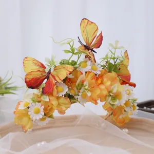 Exquisite floral crown headband detail with yellow silk flowers and butterflies for elegant dress.