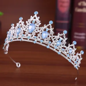 Detailed shot of a silver rhinestone crown tiara, perfect for party, prom, and queen updo styles.
