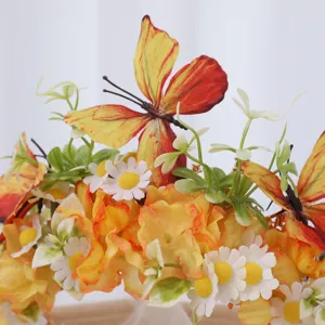 Close-up detail of luxury floral butterfly headband with yellow fabric flowers and daisies.