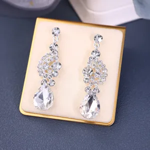 Elegant silver-tone crystal dangle earrings with sparkling teardrop rhinestones for bridal.