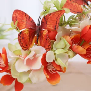 Detailed close-up of a luxury floral crown headband with vibrant silk flowers and butterflies.