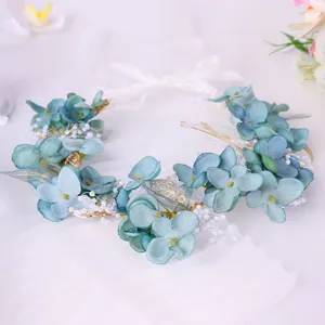 Blue floral hair wreath headband with pearls for bridal wedding beach party photography detail.