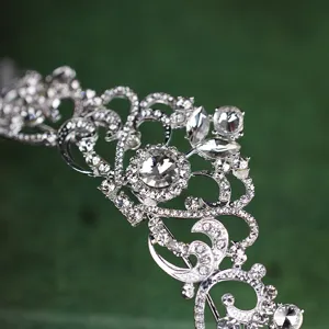 Bridal rhinestone tiara detail shot, sparkling crystal wedding crown hair accessory.