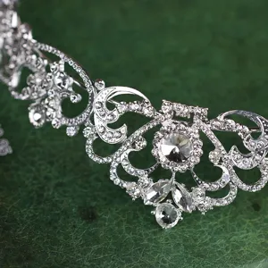 Detailed close-up of a sparkling silver rhinestone bridal tiara crown, elegant wedding hair accessory.