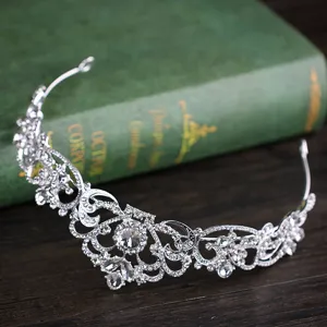 Silver rhinestone bridal tiara hair accessory, elegant crown for wedding and party events.