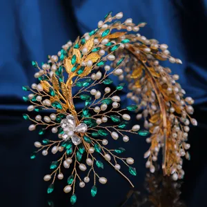 Elegant gold wire bridal headband with green crystal leaves, pearls and sparkling rhinestones.