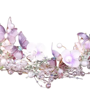 Handmade bridal butterfly hair vine with pearls and purple flowers for wedding and parties.
