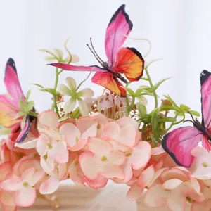 Close-up detail of luxury floral headband, baroque pink silk flowers with cute butterflies.