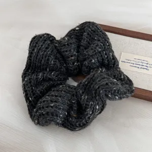 Dark grey knit hair scrunchie, cozy woolen wide hair band with soft textured winter accessory.