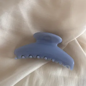Detailed close-up shot of the elegant blue jelly hair claw clip showing smooth resin texture.