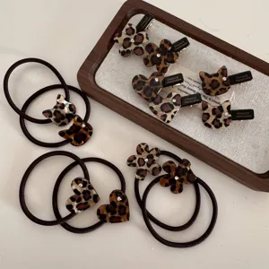 Leopard print hair clips and hair ties set, stylish acetate design with sparkling rhinestones.