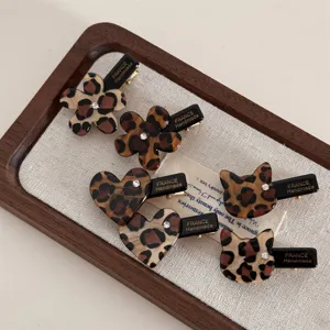 Leopard print acetate hair clips with cute flower heart and cat designs sparkle crystal details.