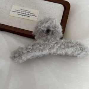 Fluffy grey hair claw clip for thick hair, large plush winter hair catcher accessory for women.