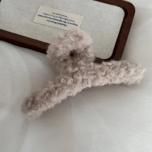 Fluffy hair claw clip for women, large winter plush shark clip for thick hair styling accessories.