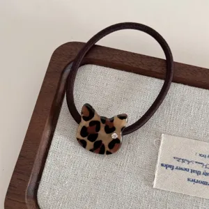 Leopard print cat hair tie detail, cute crystal rhinestone accent on brown elastic band.