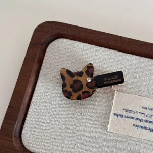 Leopard print cat hair clip detail, acetate duckbill hairpin with sparkling rhinestone accent.