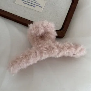 Large plush hair claw clip for women, fluffy winter hair accessory, pink shark clip style.