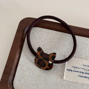 Elegant leopard print cat hair tie with rhinestone detail, cute acetate hair accessory for women.