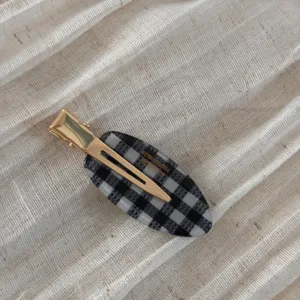 Korean style oval black and white plaid hair clip with gold metal alligator clip for women.
